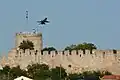 F-16 Block 52+ (from the Greek F-16 Demo Team "Zeus") flying over the Byzantine fortress of Kavala (2014 AirSea Show)