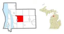 Location within Antrim County (red) and an administered portion of the Bellaire village (pink)