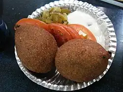 Kibbeh; pounded bulgur wheat with meat filling