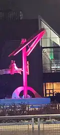 The Keepers of the Fire sculpture lit