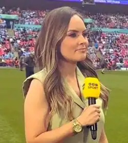 A picture of a woman holding a microphone