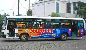The appearance of a regular city bus owned by PO Rodta route D with a body covered with an advertising sticker for a furniture product, 25 May 2013.