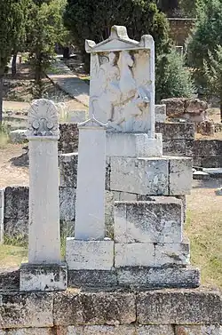 Marble tombstones, including one showing a figure on horseback spearing a defeated enemy
