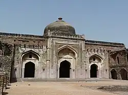 Khairul Manzil, a mosque and later a madrasa built by Maham Anga, stands opposite Purana Qila.