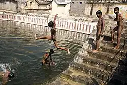 Boys nude swimming in a sacred tank in Tiruvannamalai, India (2006)