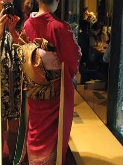 A complex obi knot worn with a furisode