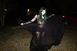 Kitty Ray in a long black dress