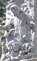Part of the Knesset Menorah includes relief of a lamb, lion, various other animals, and a little child under a representation of Isaiah.
