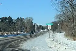 Looking north at the sign for Knowlton on County DB