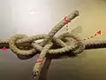 From double harness bend with parallel ends ABOK #1421 to Reever bend: ends through opposite half hitch