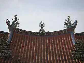 Southern Chinese architectural influences can be seen on the roof, which is adorned with various figurines.