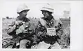 US and Korean Marines share Korean C-rations