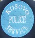 Former cap badge of the Kosovo Police Service[26]
