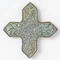 Tile in the shape of a cross with scrolls and birds c. 1250 - c. 1299. The Rijksmuseum