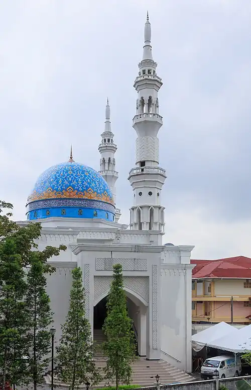 Front view of Masjid Albukhary, KL showing the White Facade and Blue Dome