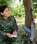 Kurdish Female fighter of the Women's Protection Units (YPJ) wearing MARPAT