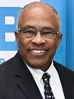Kurt Schmoke smiling at a keynote address