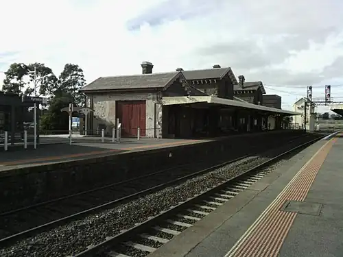 View from Platform 2 looking east, showing the station building on Platform 1