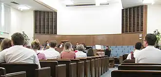 A group of people sitting in rows of seats