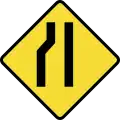 Road narrows on the left