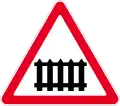 Level crossing ahead, with gates
