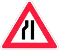 Road narrows on left side