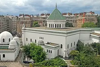 View of the mosque's exerior, with the prayer hall (centre right) and hammam (left)