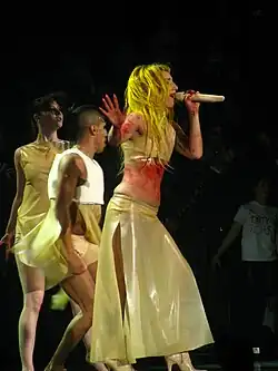 Lady Gaga singing with a mic in her hand