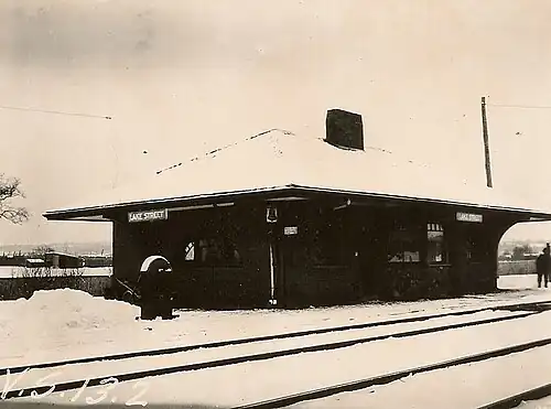 A small railway station covered with snow