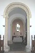 11th-century tower arches and 12th- or 13th-century west window