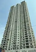 A residential high-rise building with white exterior.