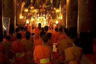 Image 9Monks gathered at evening prayer (from Culture of Laos)