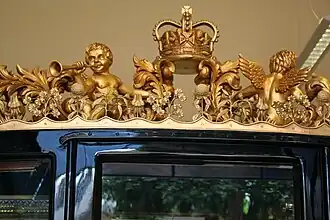 Gilded sculptures and ornamentation on the coach roof