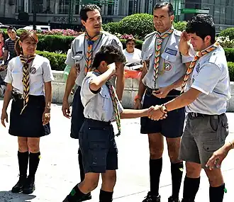 Leaders welcome a boy into Scouting, March 2010, Mexico City, Mexico. Note the left-handed handshake.