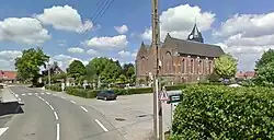 View of Ledringhem church, graveyard and town hall