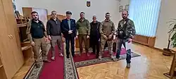 Adam Słomka amidst soldiers and officers of the Ukrainian Army in Kiev 2022