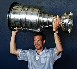 Nicklas Lidstrom hoisting the Stanley Cup