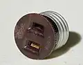 Converts a light bulb socket into an electrical receptacle