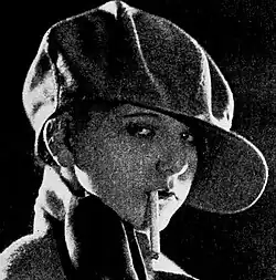 Still image from the 1925 film Lilies of the Streets showing a posed dramatic scene