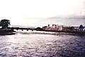 a view of a road bridge with a castle on the right bank