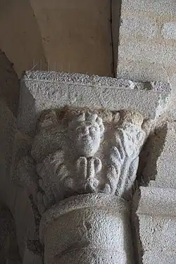 Romanesque column capital on the porch of the bell tower
