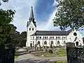 Lindome church located on a hill overlooking the parish.