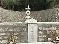 A Buddhist grave in the cemetery, containing the remains of a temple priest