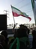 Lion and Sun flag being waved during the Green Movement solidarity protest in Irvine, CA on 21 June 2009