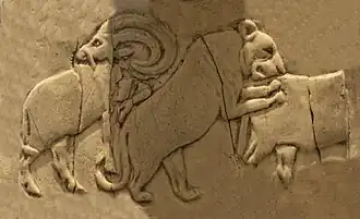 Lioness attacking a wild bull (Back, 4th register), another Mesopotamian motif.[36]
