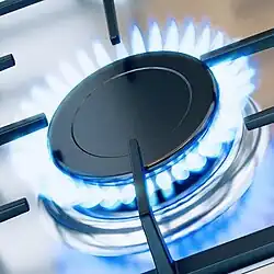 Gas-powered stovetop burner with blue flame