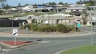 Looking from Jasmine Crescent across new housing developments towards the Mother Teresa Catholic Primary School, Ormeau, 2014