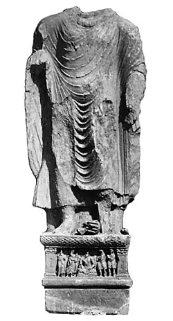 Kanishka I: Buddha from Loriyan Tangai with inscription mentioning the "year 318" of the Yavana era (AD 143).[126]