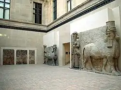Museum gallery showing lamassu and relief panels from Dur-Sharrukin