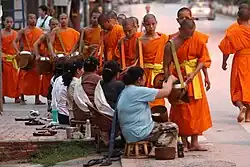 Image 1Monks gathering morning alms (from Culture of Laos)